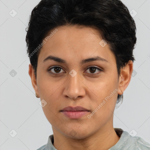 Joyful latino young-adult female with short  brown hair and brown eyes