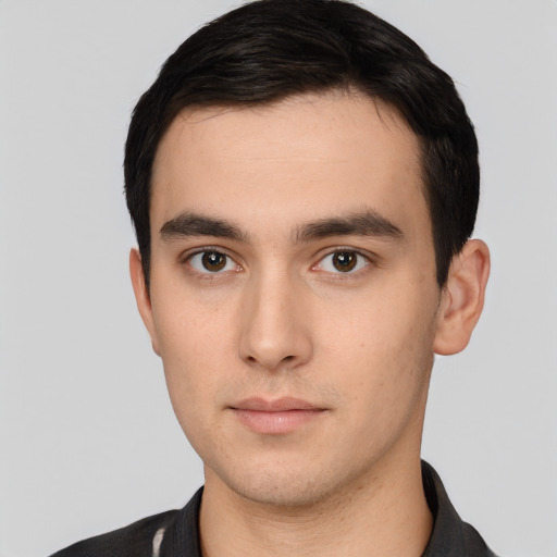Neutral white young-adult male with short  black hair and brown eyes