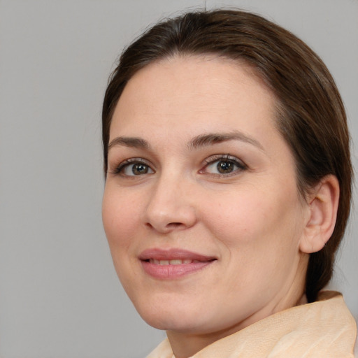 Joyful white young-adult female with medium  brown hair and brown eyes