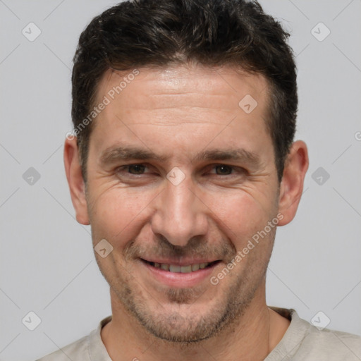 Joyful white adult male with short  brown hair and brown eyes