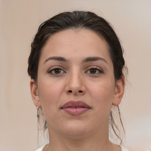 Joyful white young-adult female with medium  brown hair and brown eyes