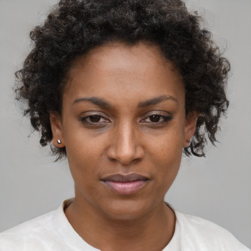 Neutral black young-adult female with short  brown hair and brown eyes