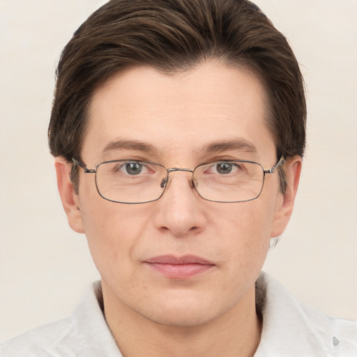 Joyful white adult male with short  brown hair and grey eyes