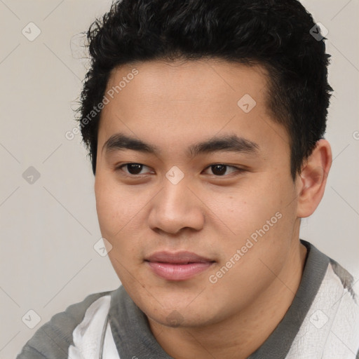 Joyful latino young-adult male with short  brown hair and brown eyes