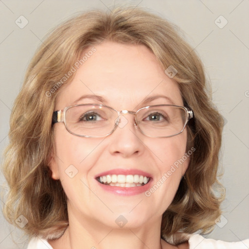 Joyful white adult female with medium  brown hair and blue eyes