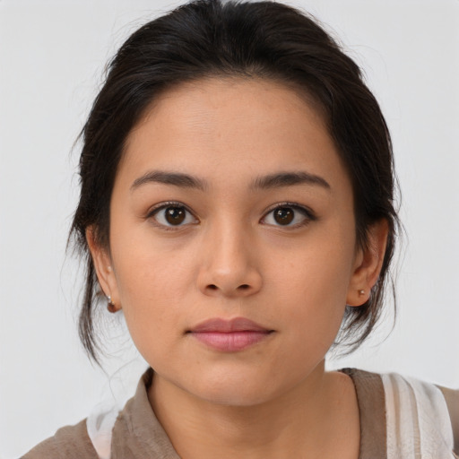 Neutral latino young-adult female with medium  brown hair and brown eyes