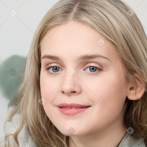 Joyful white young-adult female with long  brown hair and blue eyes