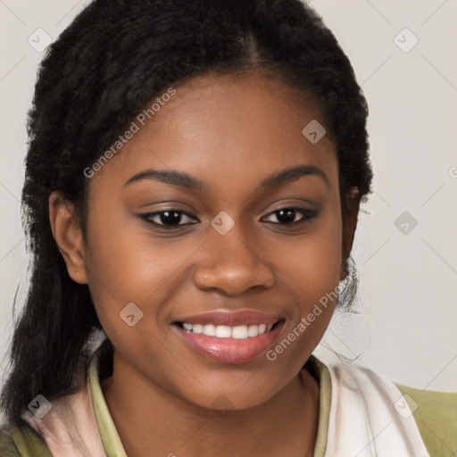 Joyful black young-adult female with long  brown hair and brown eyes