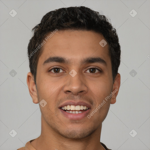 Joyful latino young-adult male with short  brown hair and brown eyes