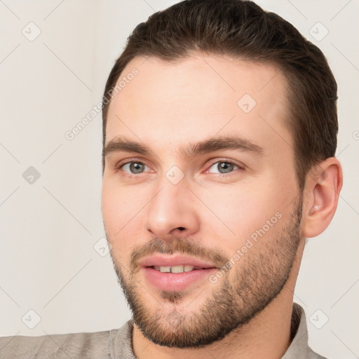 Joyful white young-adult male with short  brown hair and brown eyes