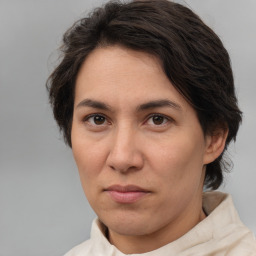 Joyful white adult female with medium  brown hair and brown eyes