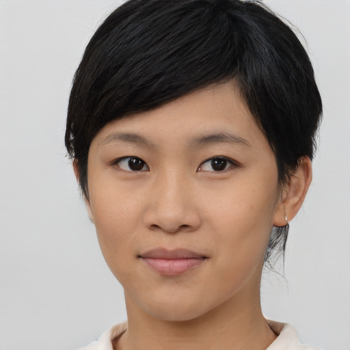 Joyful asian young-adult female with medium  black hair and brown eyes