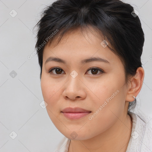 Joyful asian young-adult female with medium  brown hair and brown eyes