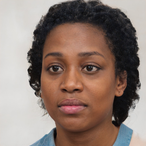 Neutral black young-adult female with medium  black hair and brown eyes