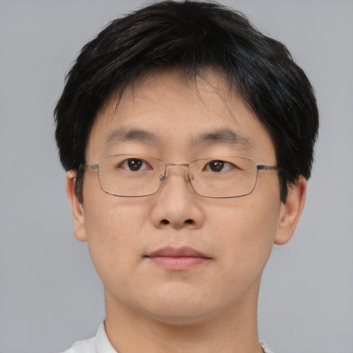 Neutral asian adult male with short  brown hair and brown eyes