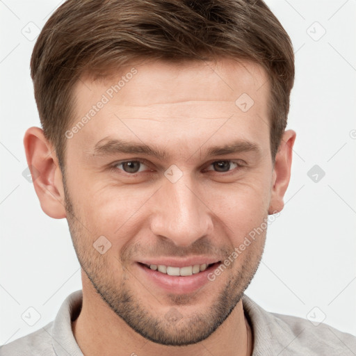 Joyful white young-adult male with short  brown hair and grey eyes