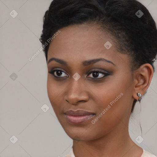 Joyful black young-adult female with short  brown hair and brown eyes