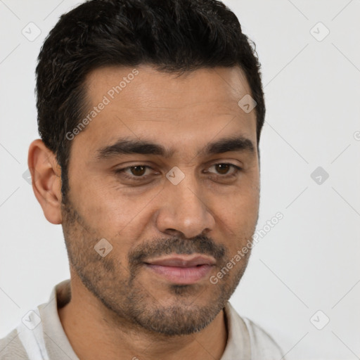 Joyful white young-adult male with short  black hair and brown eyes