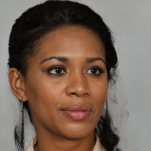 Joyful black young-adult female with medium  black hair and brown eyes