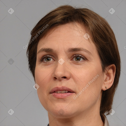 Joyful white adult female with medium  brown hair and brown eyes