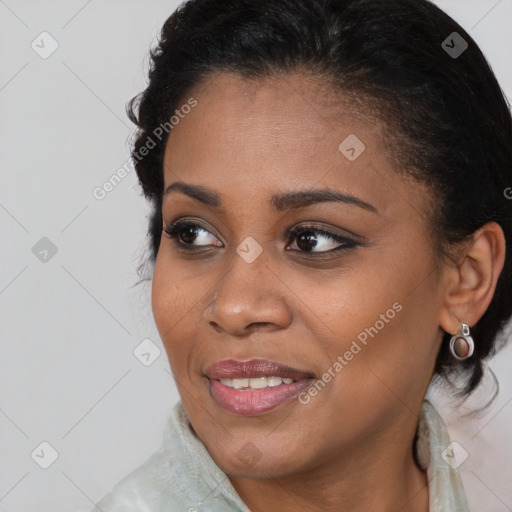 Joyful black young-adult female with medium  brown hair and brown eyes