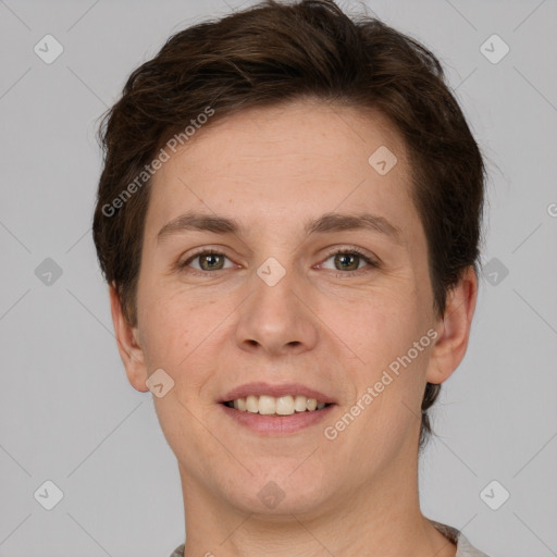 Joyful white young-adult female with short  brown hair and grey eyes