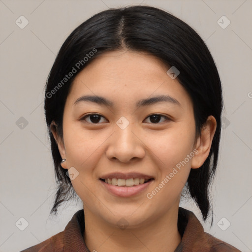 Joyful asian young-adult female with medium  black hair and brown eyes