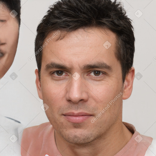 Joyful white young-adult male with short  brown hair and brown eyes