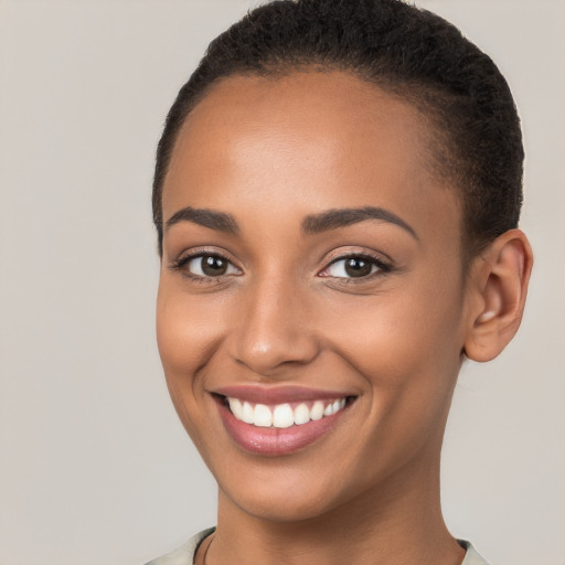 Joyful latino young-adult female with short  brown hair and brown eyes