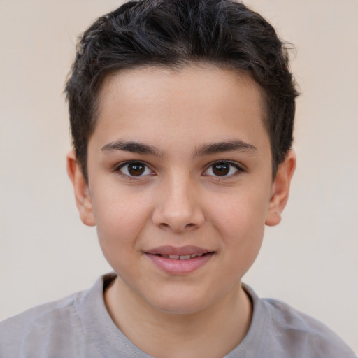 Joyful white child male with short  brown hair and brown eyes