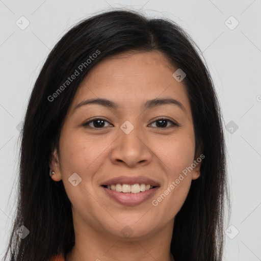 Joyful latino young-adult female with long  brown hair and brown eyes