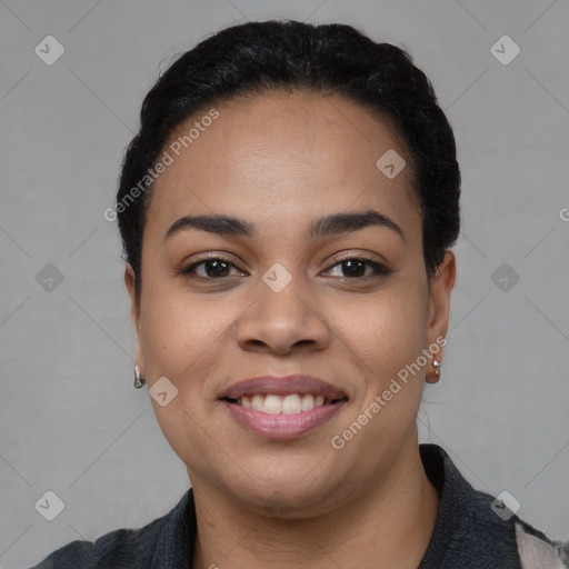 Joyful black young-adult female with short  black hair and brown eyes