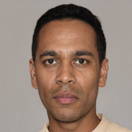 Neutral latino young-adult male with short  black hair and brown eyes