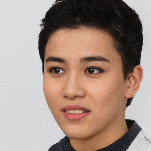 Joyful asian young-adult female with short  black hair and brown eyes