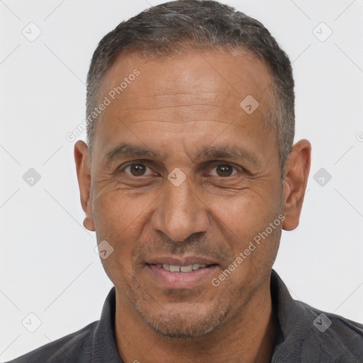 Joyful white adult male with short  black hair and brown eyes