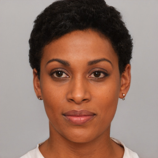 Joyful latino young-adult female with short  black hair and brown eyes