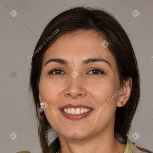 Joyful white adult female with medium  brown hair and brown eyes