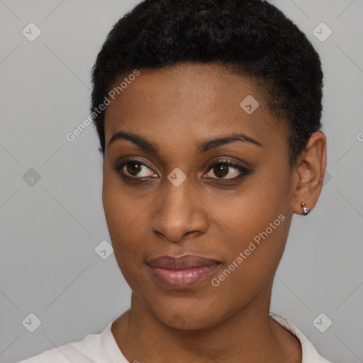 Joyful black young-adult female with short  brown hair and brown eyes