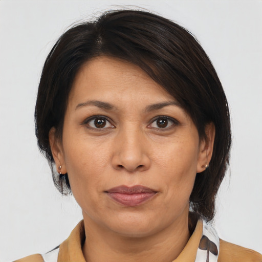 Joyful asian adult female with medium  brown hair and brown eyes
