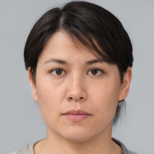 Neutral asian young-adult female with medium  brown hair and brown eyes