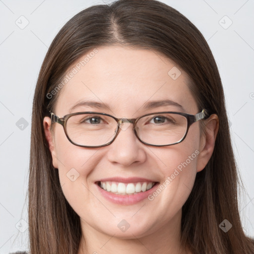 Joyful white young-adult female with long  brown hair and grey eyes