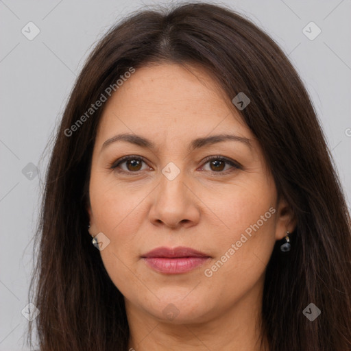 Joyful white adult female with long  brown hair and brown eyes