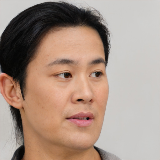 Neutral asian young-adult male with medium  black hair and brown eyes