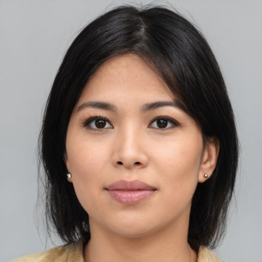Joyful asian young-adult female with medium  black hair and brown eyes
