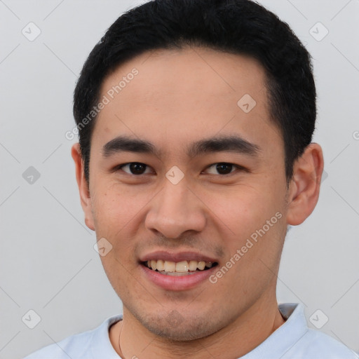 Joyful white young-adult male with short  black hair and brown eyes