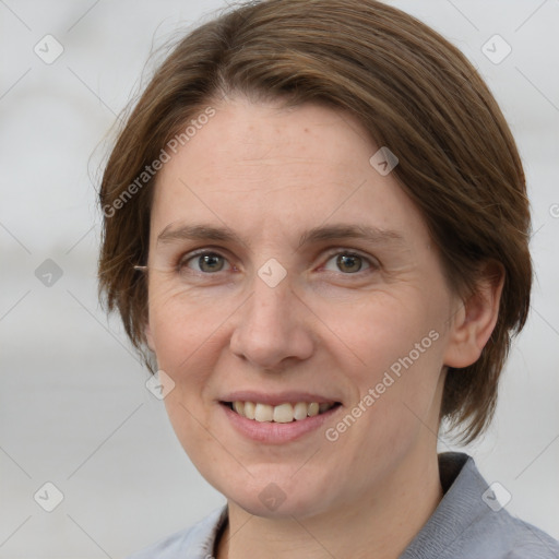 Joyful white adult female with medium  brown hair and grey eyes