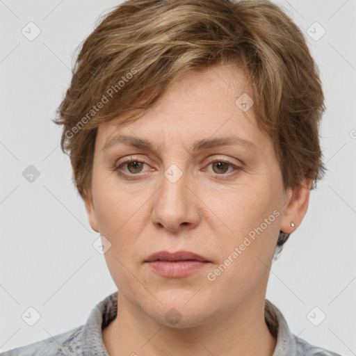 Joyful white adult female with short  brown hair and grey eyes