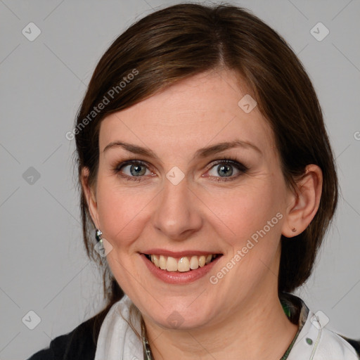 Joyful white young-adult female with medium  brown hair and blue eyes