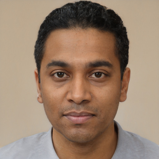 Neutral black young-adult male with short  black hair and brown eyes