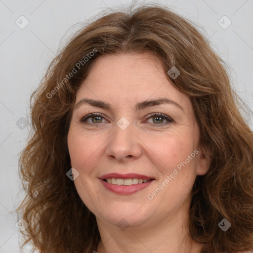 Joyful white adult female with long  brown hair and brown eyes